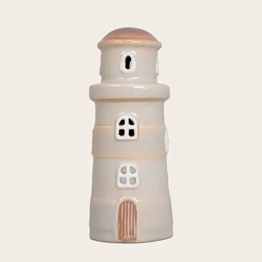 Beige og hvid fyrtårn keramik hus.