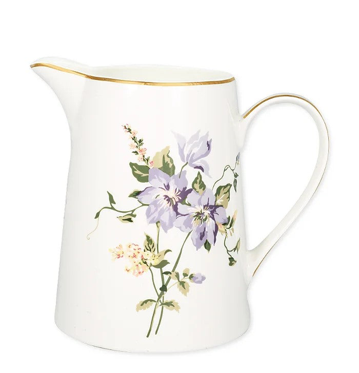 Porcelæns kande med blomster og guldkant.