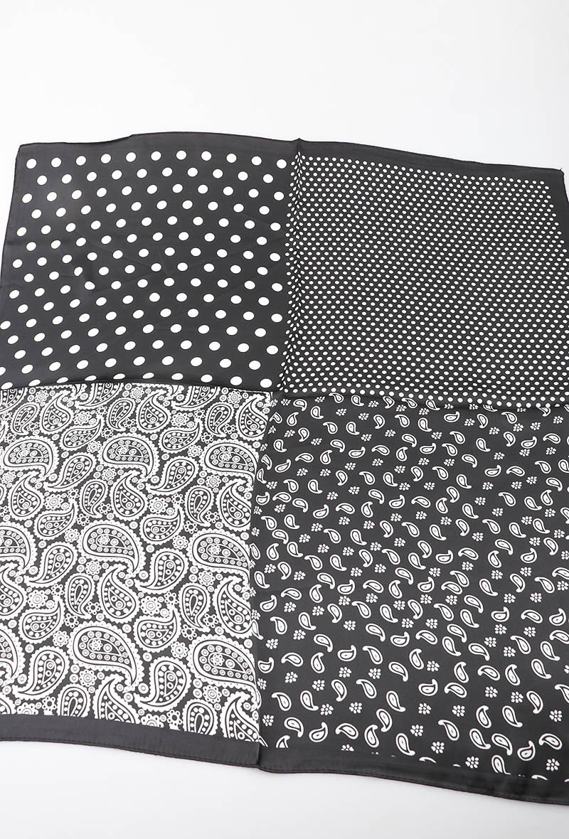 Satin tørklæde med sort og hvidt mønster.